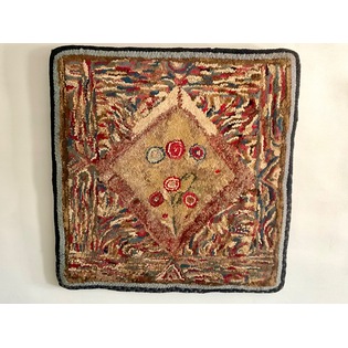 A graphic, hooked rug exhibiting Shaker characteristics